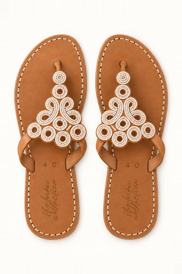 Korosho White beaded sandals, pair viewed from above