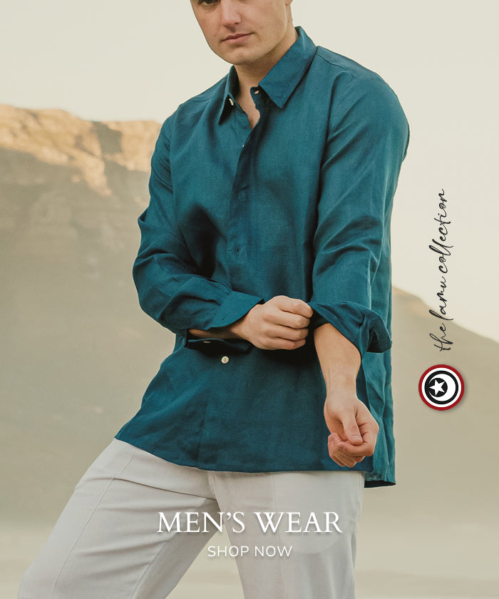 Man wearing a teal long-sleeve shirt.