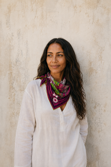 Flourish Emerald Silk Scarf, 50 × 50 cm, worn as a neckerchief in Lamu
