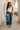 Flourish Teal Silk Scarf, 135 × 135 cm, worn as a sarong in Lamu