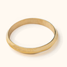 Bangili brass bangle on a light background.