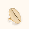 Nusu Mwezi Smooth brass ring on a light background.