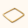 Mraba Smooth brass bangle on a light background.