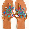 Corona leather sandals with multicolored circular beadwork and teardrop motifs, pair viewed from above.