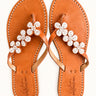 Ua Zuri White leather sandals with white beaded flower straps, pair viewed from above.